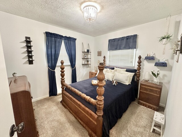 1870 Rush Branch Rd, Somerset, KY 42501 - carpeted bedroom with baseboards, a notable chandelier, and a textured ceiling