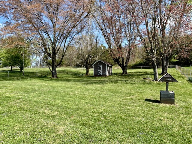 1870 Rush Branch Rd, Somerset, KY 42501 - view of yard featuring an outdoor structure, fence, and a storage unit