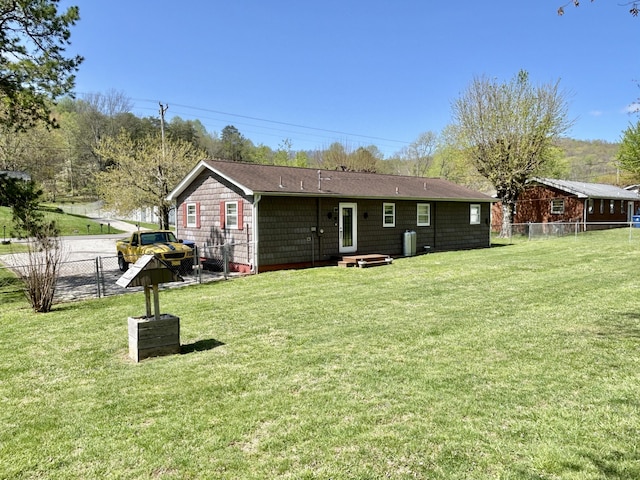 1870 Rush Branch Rd, Somerset, KY 42501 - rear view of house with fence and a lawn