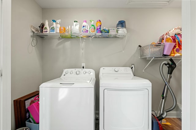 laundry area featuring washing machine and clothes dryer and laundry area
