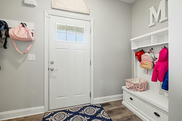 mudroom featuring baseboards, dark wood-style floors, and visible vents