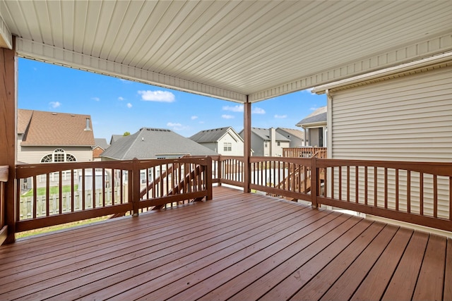 wooden deck featuring a residential view