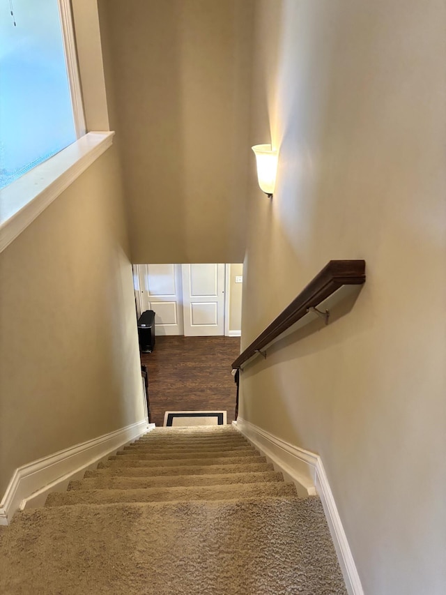 stairs featuring baseboards