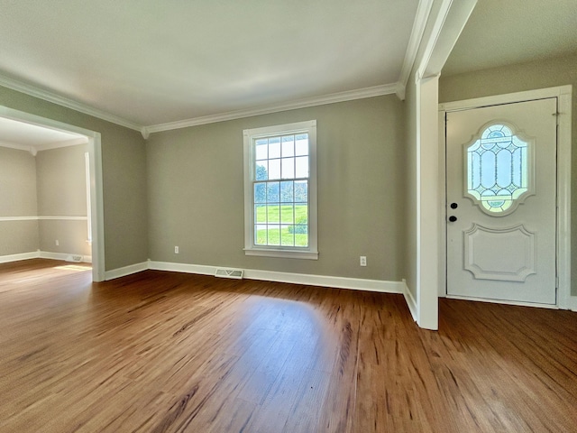 entrance foyer with crown molding, wood finished floors, and baseboards