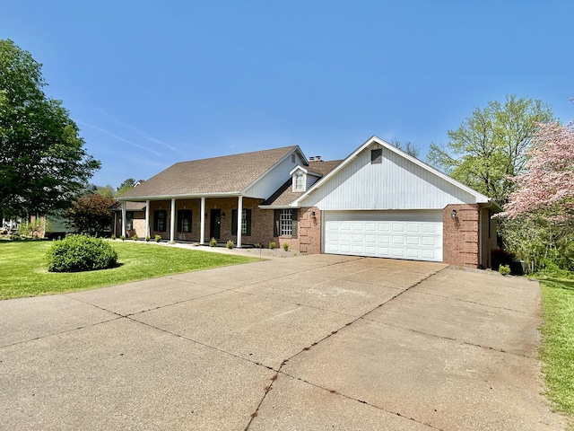 ranch-style house with driveway, a front yard, a porch, brick siding, and a garage