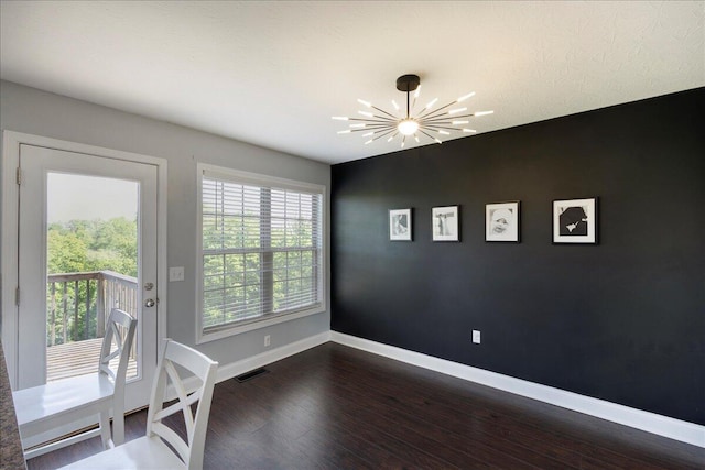 2045 Kearns Way, Richmond, KY 40475 - unfurnished dining area with a chandelier, dark wood-type flooring, and baseboards