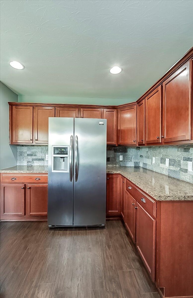 2045 Kearns Way, Richmond, KY 40475 - kitchen featuring stainless steel fridge, dark wood-style flooring, tasteful backsplash, light stone countertops, and brown cabinetry