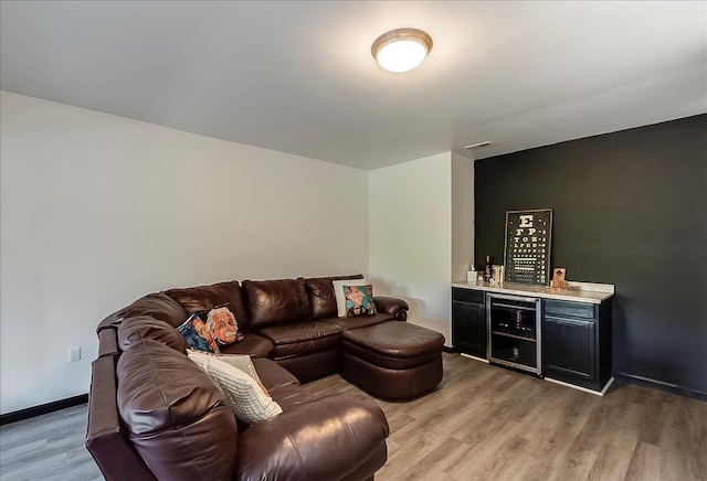 2045 Kearns Way, Richmond, KY 40475 - living room featuring beverage cooler, a dry bar, light wood finished floors, and baseboards