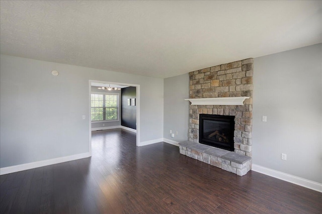 2045 Kearns Way, Richmond, KY 40475 - unfurnished living room with dark wood-style flooring, a fireplace, baseboards, and a chandelier