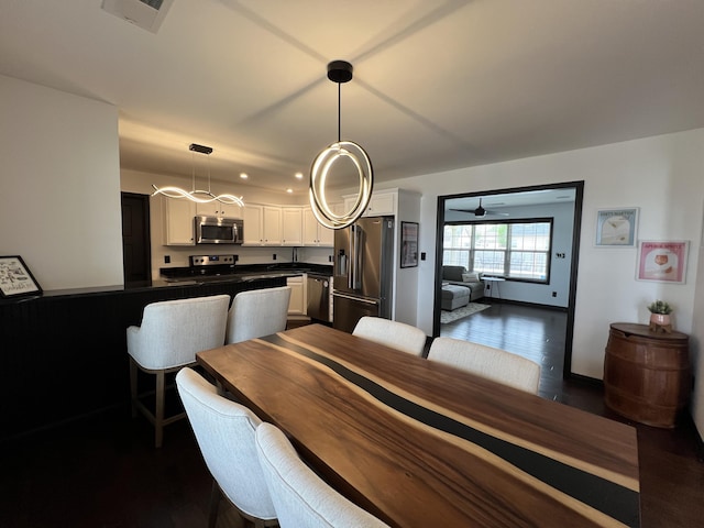 dining space featuring recessed lighting, a ceiling fan, dark wood-style flooring, and visible vents