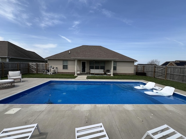 view of swimming pool featuring a fenced in pool, a fenced backyard, and a patio area