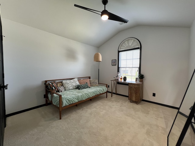 bedroom with baseboards, ceiling fan, lofted ceiling, and light carpet