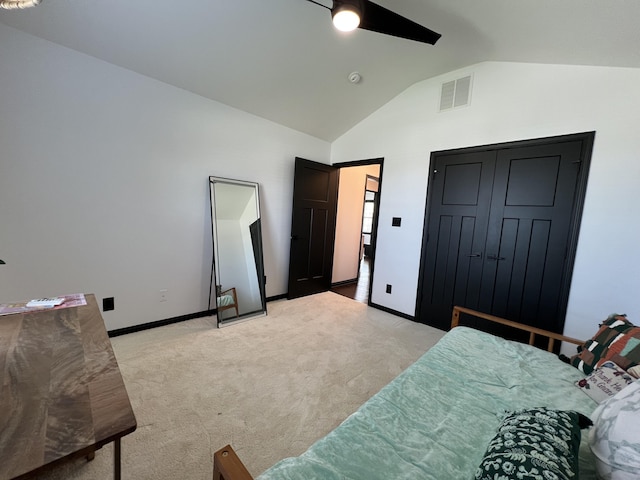 bedroom featuring ceiling fan, visible vents, light colored carpet, baseboards, and lofted ceiling