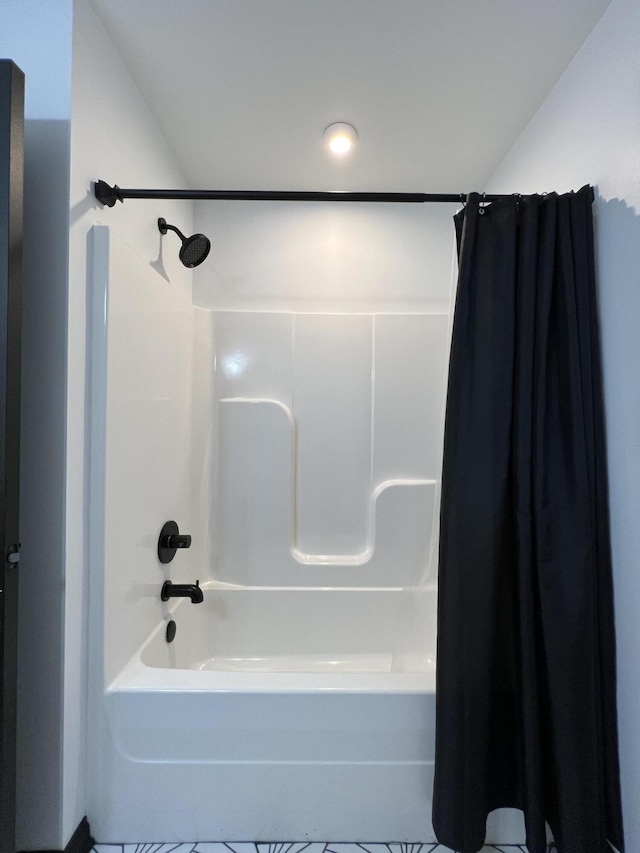 full bathroom with shower / bath combo with shower curtain