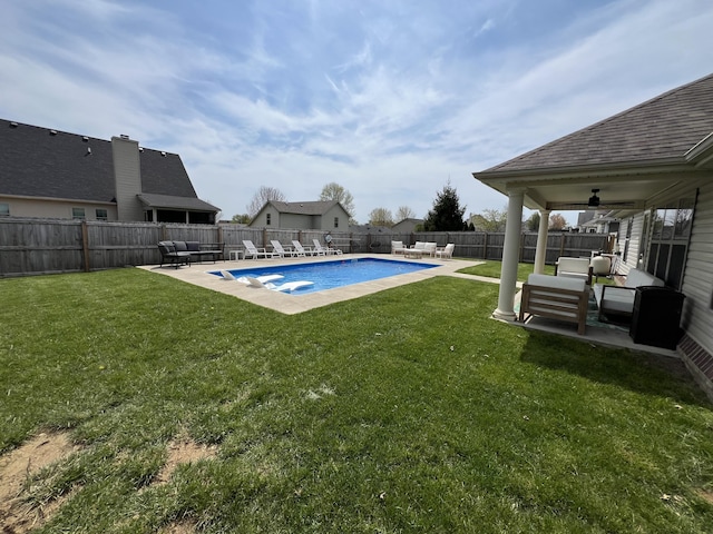 view of pool with an outdoor living space, a lawn, a fenced in pool, a fenced backyard, and a patio