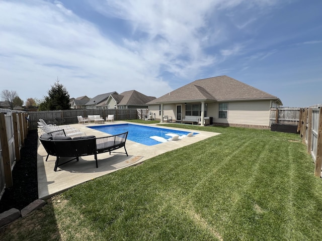 view of pool featuring a lawn, a fenced in pool, a patio, and a fenced backyard
