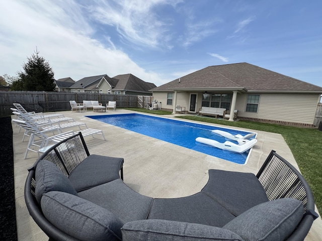 view of pool with ceiling fan, a fenced backyard, an outdoor living space, a fenced in pool, and a patio area