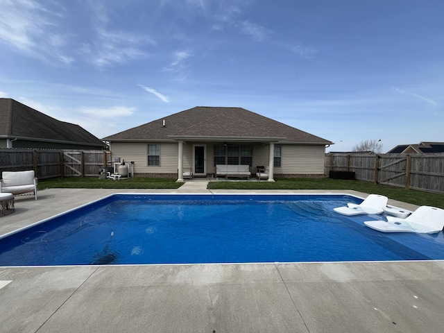 view of swimming pool with a fenced in pool, a fenced backyard, and a patio area