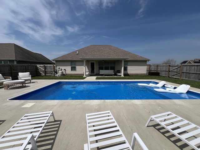 view of pool featuring a fenced backyard, a fenced in pool, and a patio area
