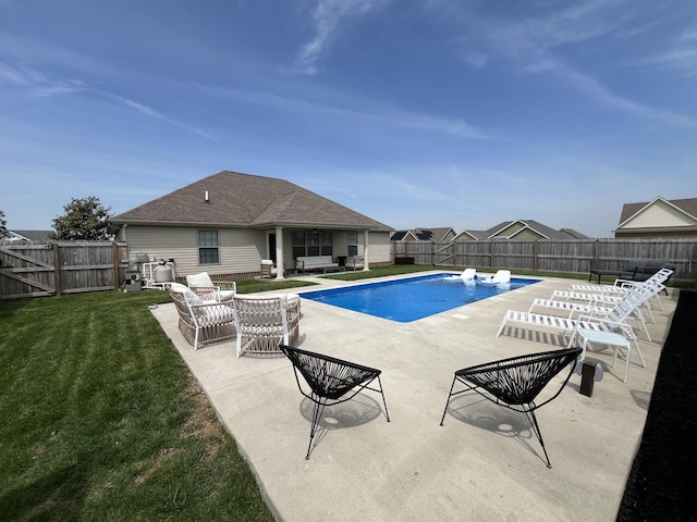 view of swimming pool featuring a lawn, a patio, an outdoor hangout area, and a fenced backyard