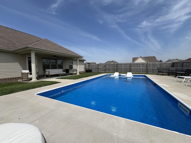 view of pool with a fenced backyard, an outdoor hangout area, ceiling fan, and a patio area