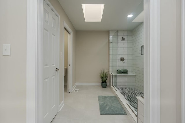 bathroom featuring baseboards, recessed lighting, toilet, a shower stall, and visible vents