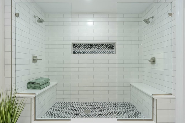 full bathroom with tiled shower