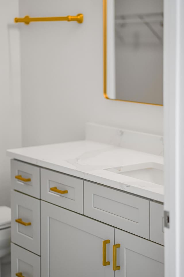 bathroom with vanity and toilet