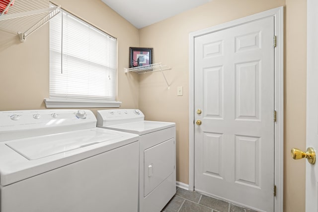 laundry room featuring baseboards, independent washer and dryer, and laundry area