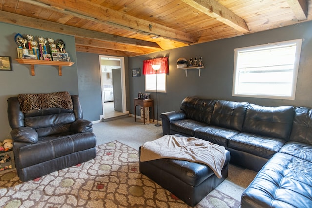 carpeted living area featuring baseboards, wood ceiling, and beamed ceiling