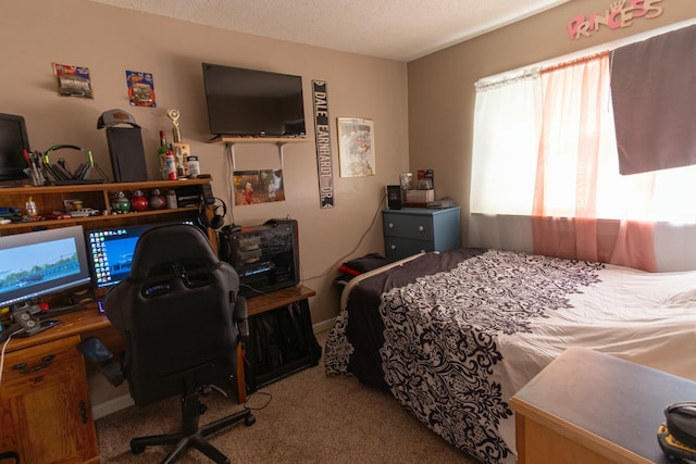 carpeted bedroom featuring a textured ceiling