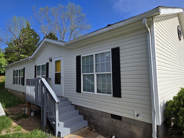 view of front of home featuring crawl space