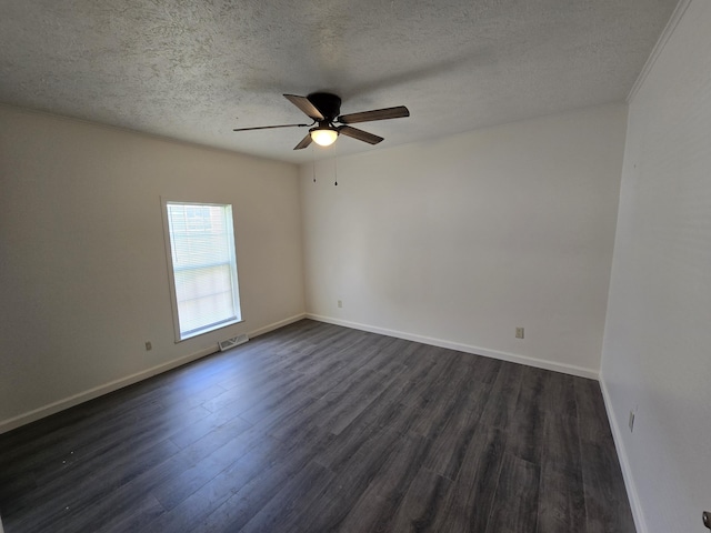 unfurnished room featuring a textured ceiling, dark wood-style flooring, baseboards, visible vents, and a ceiling fan