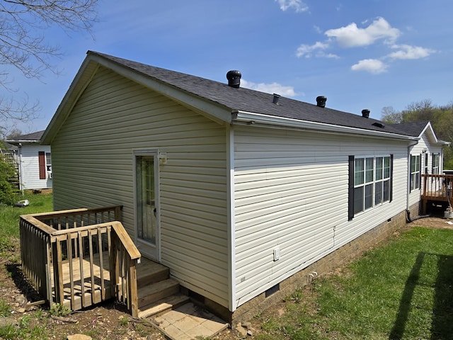 view of property exterior featuring a lawn, a wooden deck, crawl space, and a shingled roof