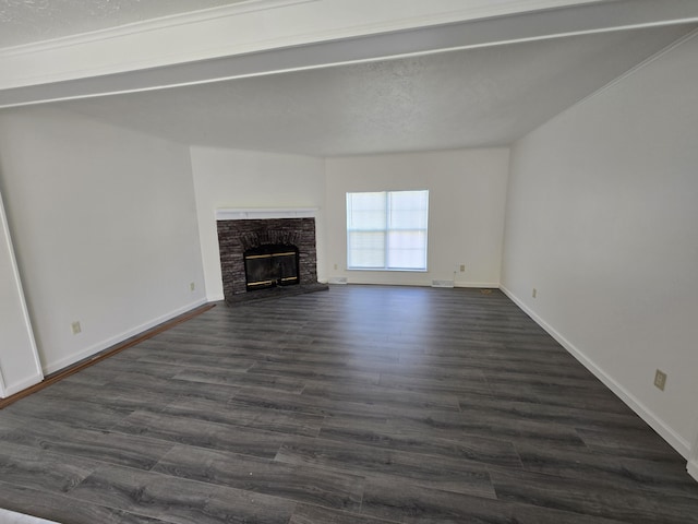 unfurnished living room featuring a fireplace, baseboards, and dark wood-style flooring