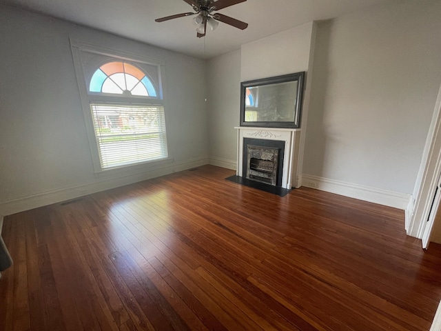 142 Old Lafayette Ave, Lexington, KY 40502 - unfurnished living room featuring baseboards, hardwood / wood-style floors, a fireplace, and ceiling fan