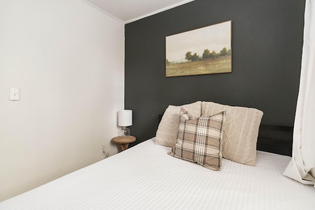 bedroom with ornamental molding
