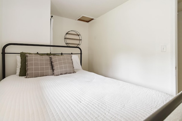 bedroom featuring attic access
