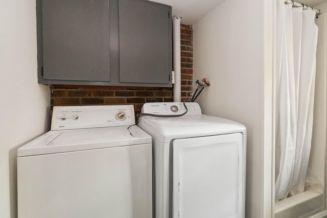 laundry area featuring washing machine and dryer and laundry area
