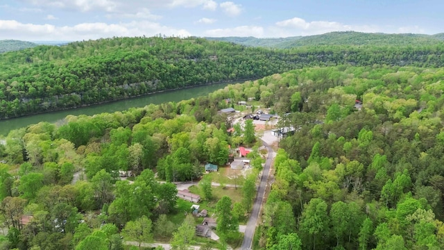 aerial view featuring a view of trees and a water view
