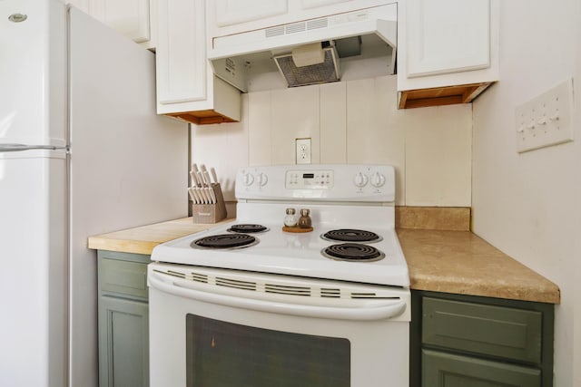 kitchen featuring green cabinetry, under cabinet range hood, white appliances, and light countertops