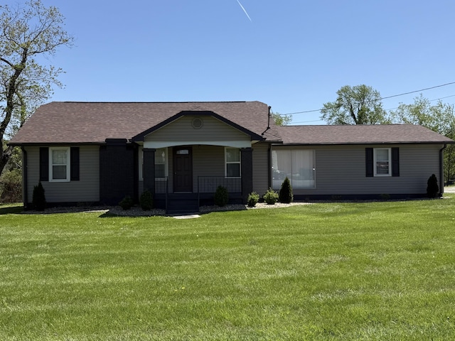 21 N Gregory St, Monticello, KY 42633 - ranch-style house featuring a front lawn, a shingled roof, and covered porch