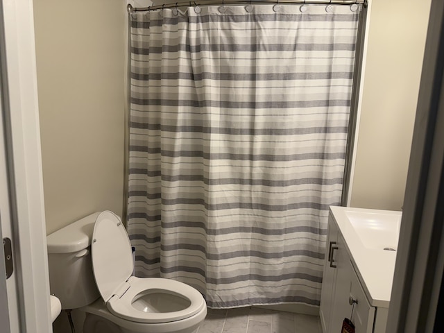 21 N Gregory St, Monticello, KY 42633 - full bathroom featuring a shower with shower curtain, vanity, marble finish floor, and toilet