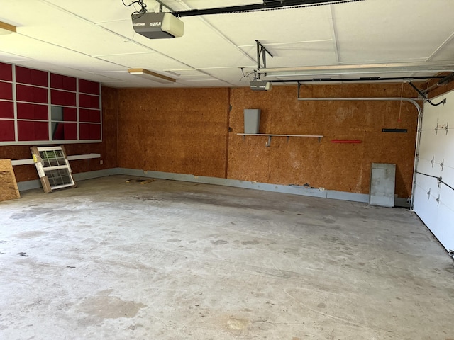21 N Gregory St, Monticello, KY 42633 - garage featuring electric panel and a garage door opener