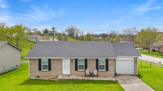 357 Burchwood Dr, Berea, KY 40403 - view of front of home with a garage, a front yard, and brick siding
