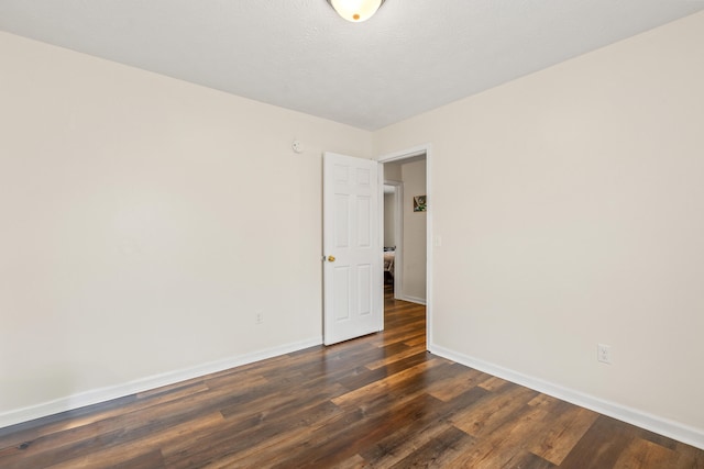 357 Burchwood Dr, Berea, KY 40403 - empty room featuring dark wood-type flooring and baseboards