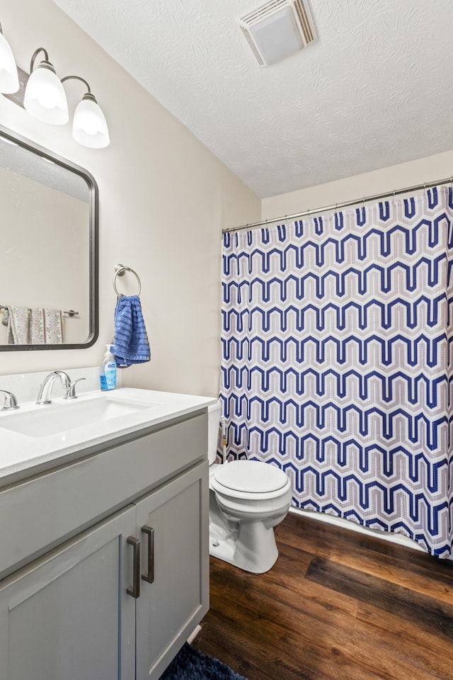 357 Burchwood Dr, Berea, KY 40403 - bathroom featuring vanity, curtained shower, toilet, visible vents, and wood finished floors