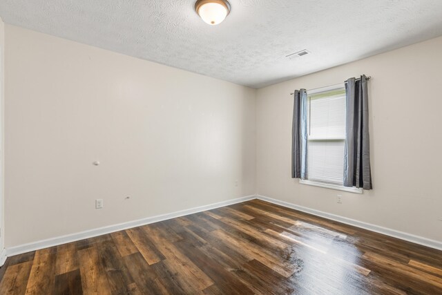 357 Burchwood Dr, Berea, KY 40403 - unfurnished room featuring visible vents, baseboards, wood finished floors, and a textured ceiling