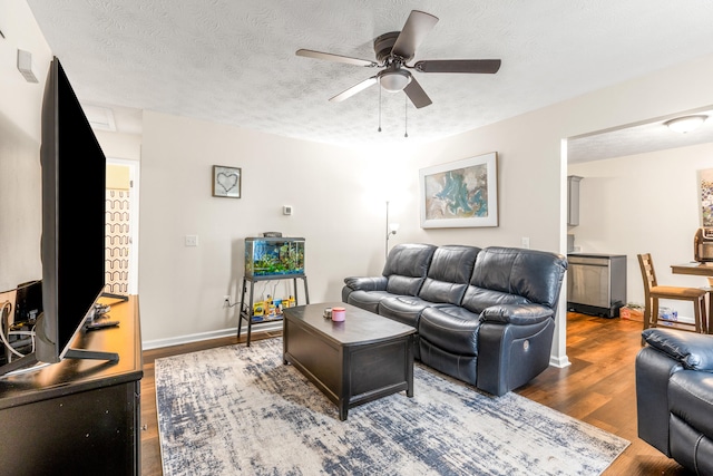 357 Burchwood Dr, Berea, KY 40403 - living area with baseboards, a textured ceiling, wood finished floors, and ceiling fan