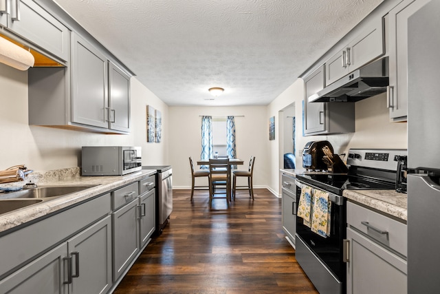 357 Burchwood Dr, Berea, KY 40403 - kitchen with gray cabinets, light countertops, under cabinet range hood, stainless steel appliances, and a sink